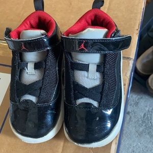 Authentic toddler boys used Air Jordan sneakers.